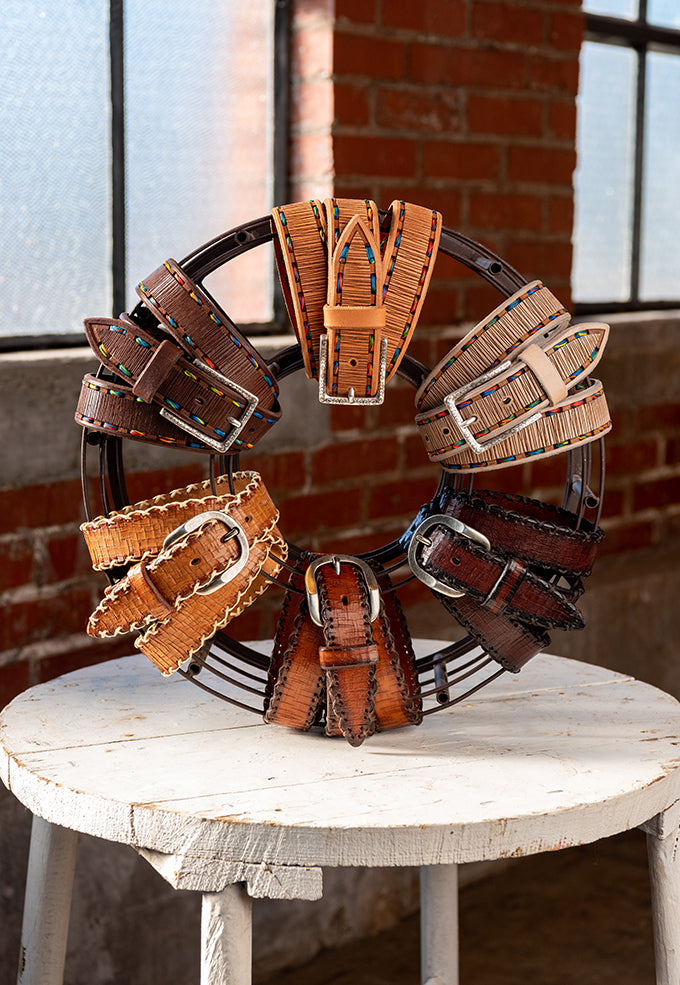 Artistan "X" Italian Bridle Leather Belts arranged in a circular display