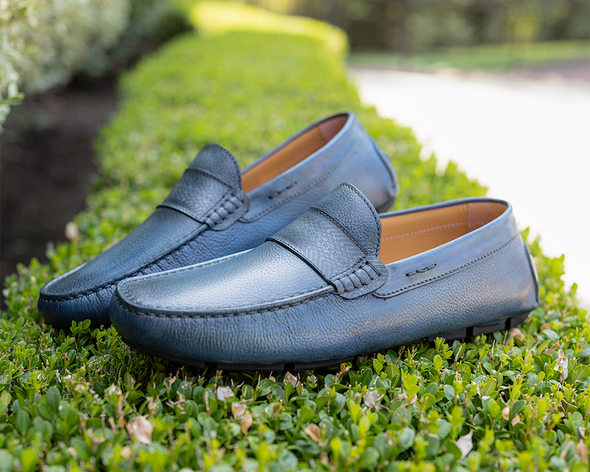 Blue loafers on grass