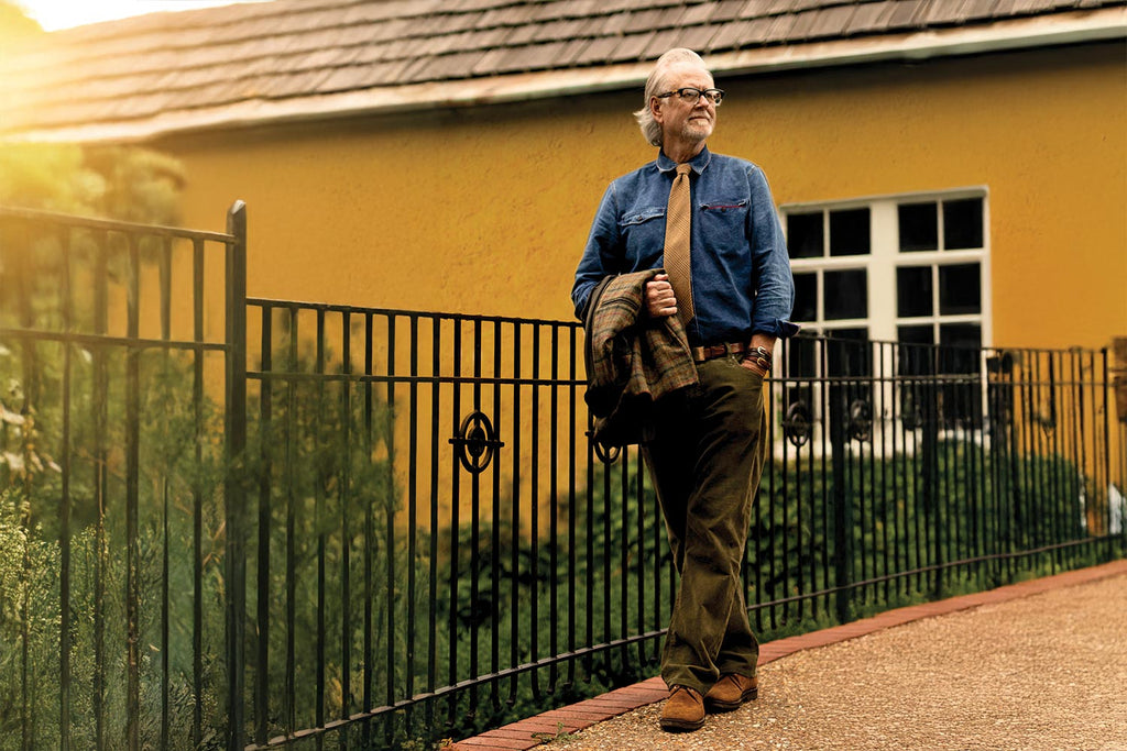 Martin Dingman standing in front of a house in Italy