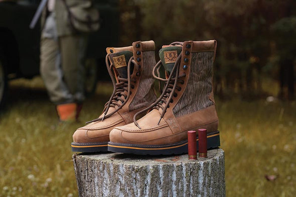 The upland hunting boot on a tree stump