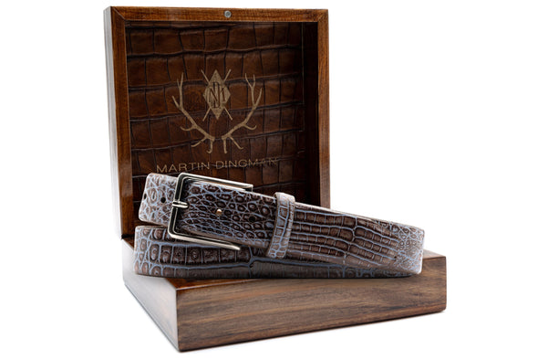 Hand Painted Genuine Caiman Crocodile Belt - Brown/Blue  in front of open Martin Dingman Solid Wood Display Box lined with Alligator Grain Leather.