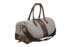Front Side View of Woodland Quilted Oxford Canvas Duffel - Stone with Camo Saddle Leather Trim