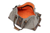 Front Side View of Woodland Quilted Oxford Canvas Duffel - Stone with Camo Saddle Leather Trim with Clamshell Zipper Open featuring Signature Orange Cotton Twill Lining