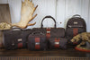 Collection of Rudyard Saddle Leather bags featuring the Leather Lodge Brief, Polocrosse Duffle, Lodge Shave Case, Journey Shave Case, and Globe Trotter Backpack