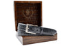 Hand Glazed Genuine American Alligator Belt - Slate in front of open Martin Dingman Solid Wood Display Box lined with Alligator Grain Leather.