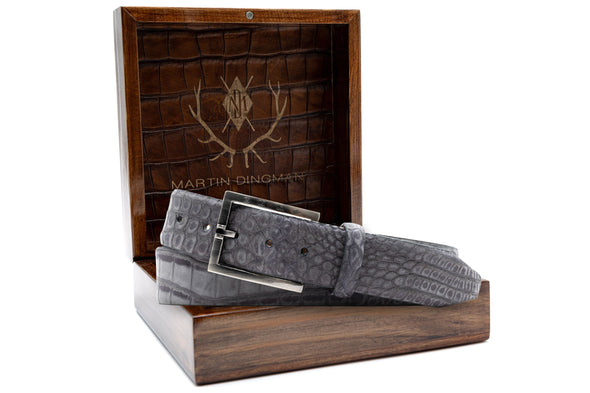 Nubuck Genuine American Alligator Belt - Slate in front of Martin Dingman Solid Wood Display Box